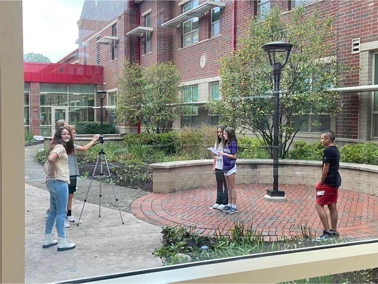 Middle schools students preparing morning announcements in the courtyard - 9.12.2022
