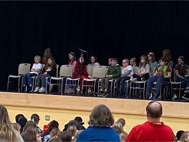 Students on stage grade three spelling bee